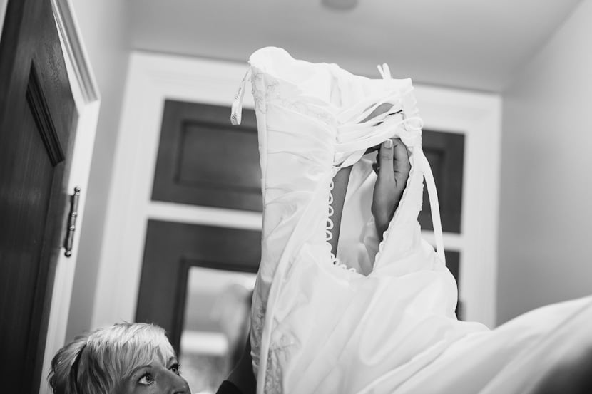 bride getting dressed before wedding
