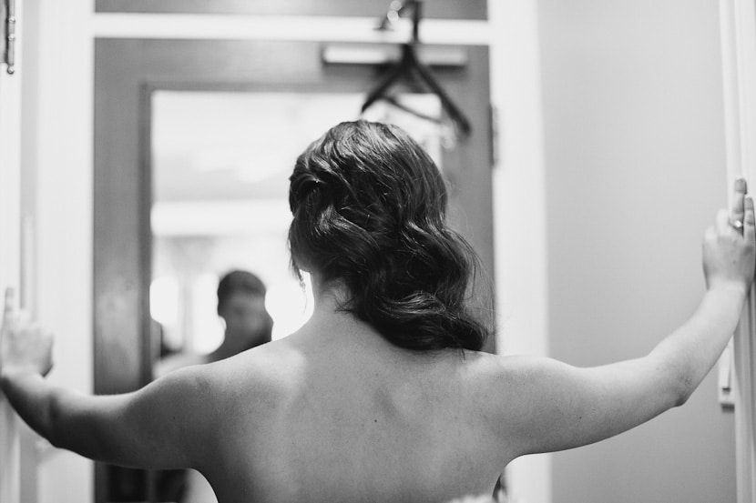 bride putting her dress on at Empress Hotel