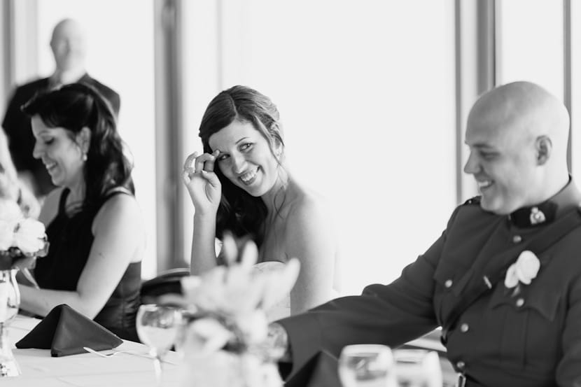 bride laughing at reception toasts