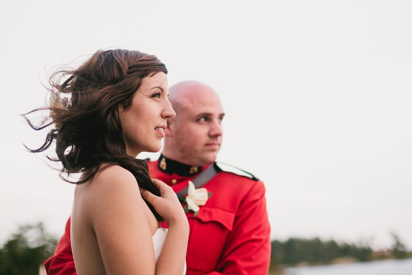 bride and groom on balcony at cfb esquimalt wedding reception