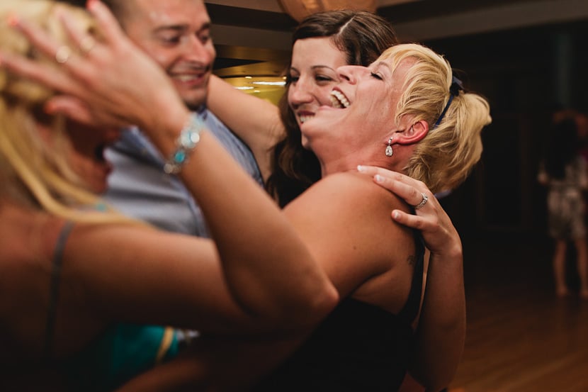 guests laughing and hugging at victoria bc wedding reception