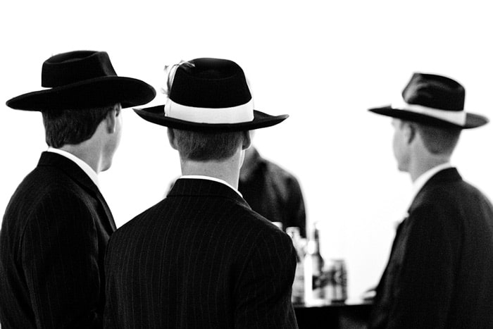 groomsmen with hats at wedding reception victoria bc
