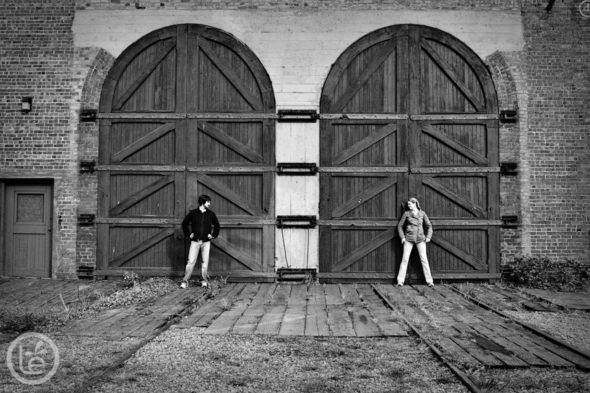 engagement session in front of big wood doors in victoria, bc