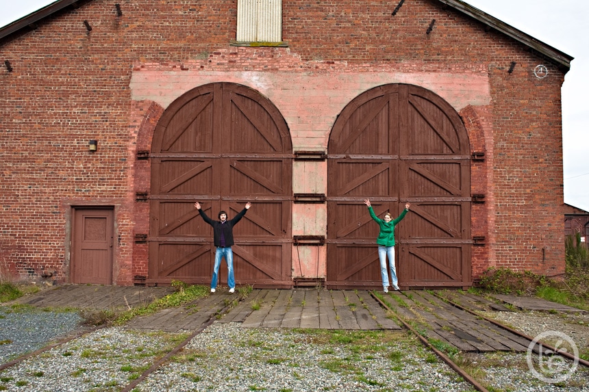 engaged couple jumping