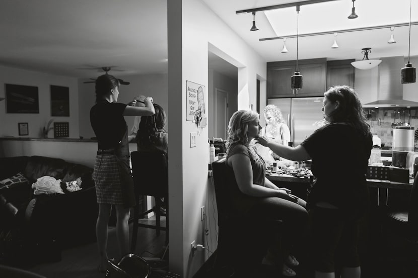 bride and bridesmaids getting ready at house