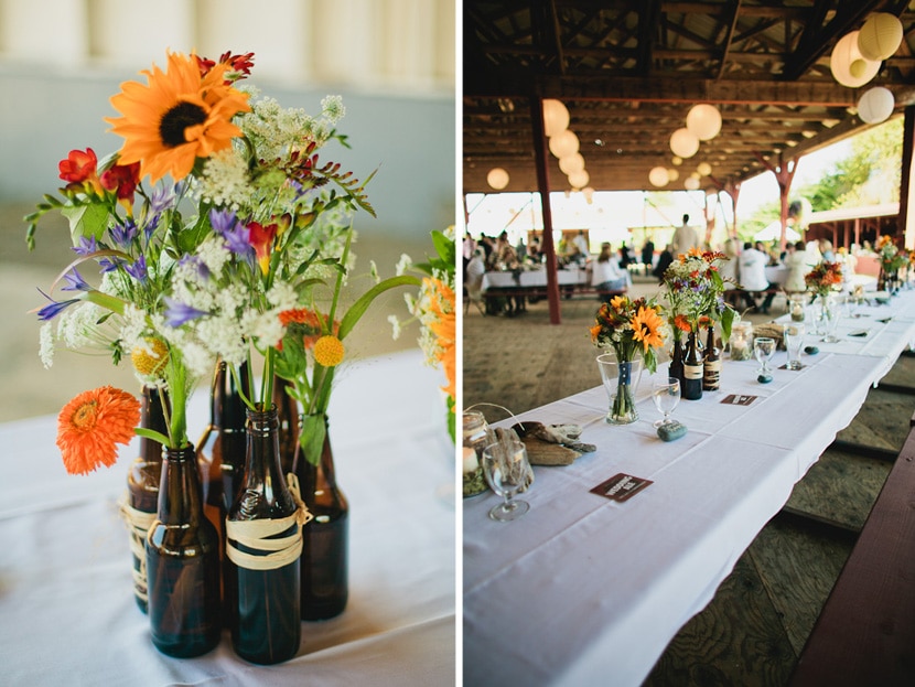 beer bottle centrepieces at rustic wedding venue