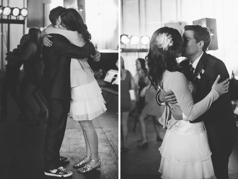 bride and groom hug and kiss on dance floor
