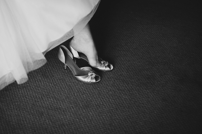 bride putting on shoes cinderella style