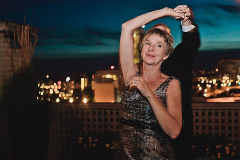 groom dances with her mother at wedding reception