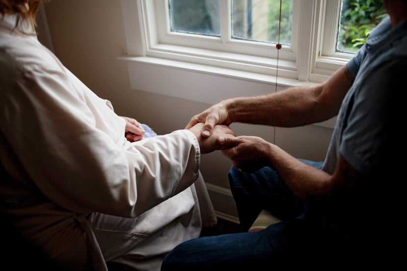 bride getting hand massage prior to wedding