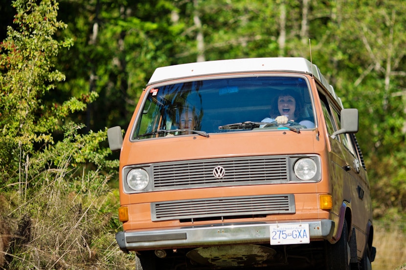 bride driving her VW bus to wedding reception on Pender Island