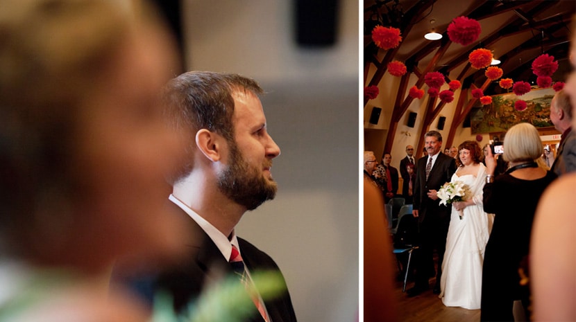 groom watching bride walk down the aisle with uncle