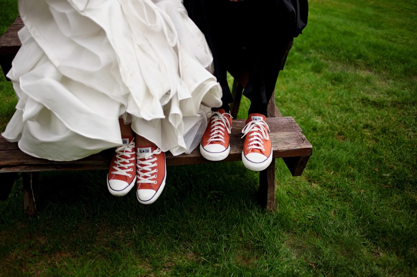 bride and groom with matching chucks converse all stars at wedding