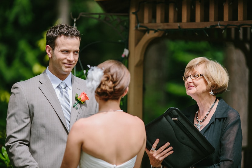 groom grinning during wedding ceremony