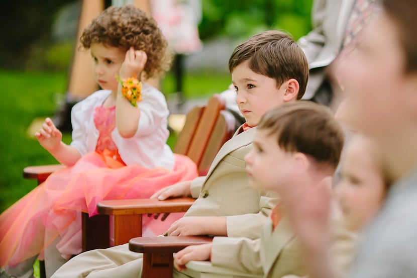 children watching backyard wedding ceremony