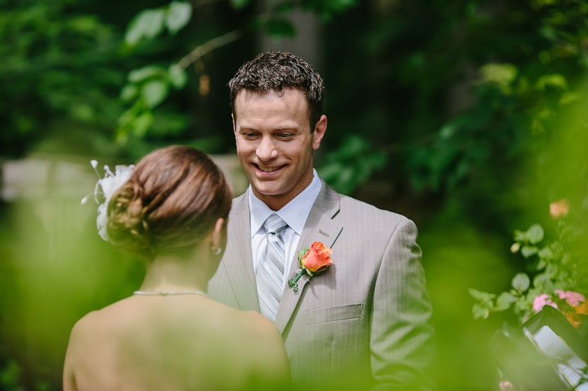 groom during backyard wedding ceremony in victoria, bc