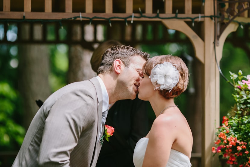 the first kiss during backyard wedding in victoria, bc