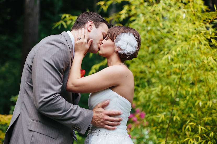 bride and groom portrait in lush backyard