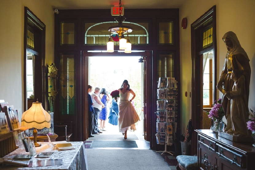 bride entering St. Ann's lobby before wedding ceremony