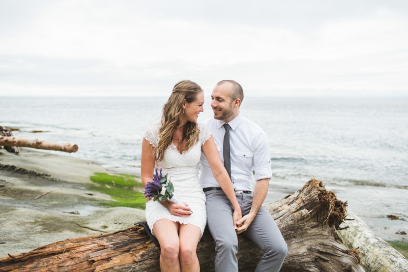 On the beach, the bride and groom only have eyes for each other.