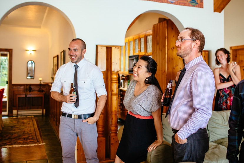 The groom relaxes with guests  - Galiano Island wedding photographer