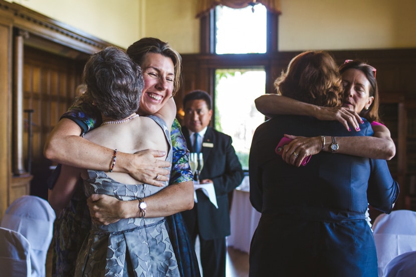 family hugs after empress hotel wedding ceremony