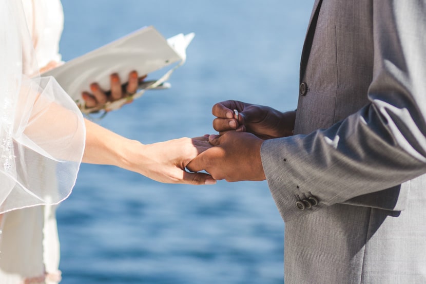 ring exchange during backyard wedding in victoria, bc