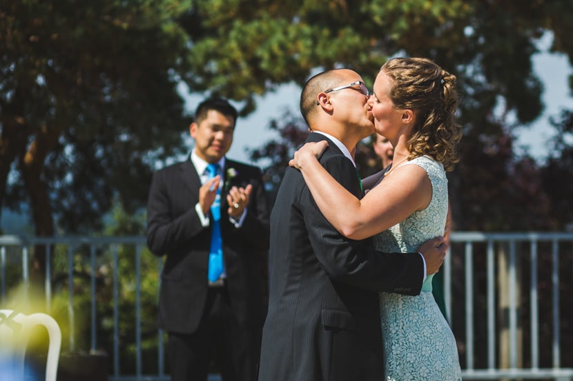the first kiss during mountain top wedding ceremony in victoria bc