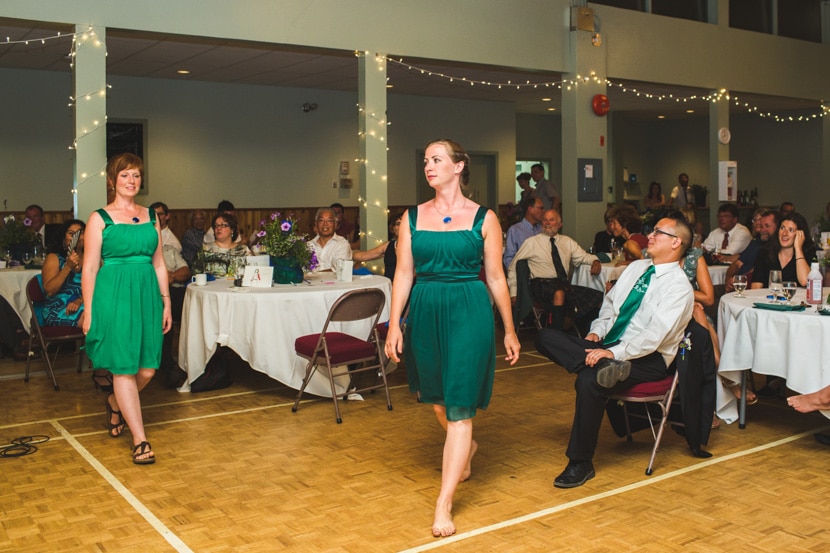 wedding party and bride do surprise dance for groom