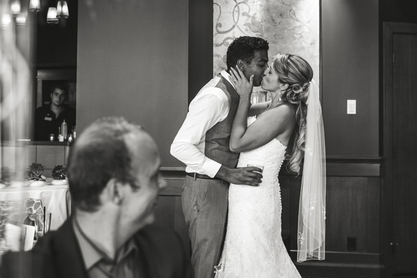 bride and groom kissing at bear mountain wedding reception