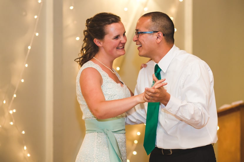bride and groom have first dance at wedding reception
