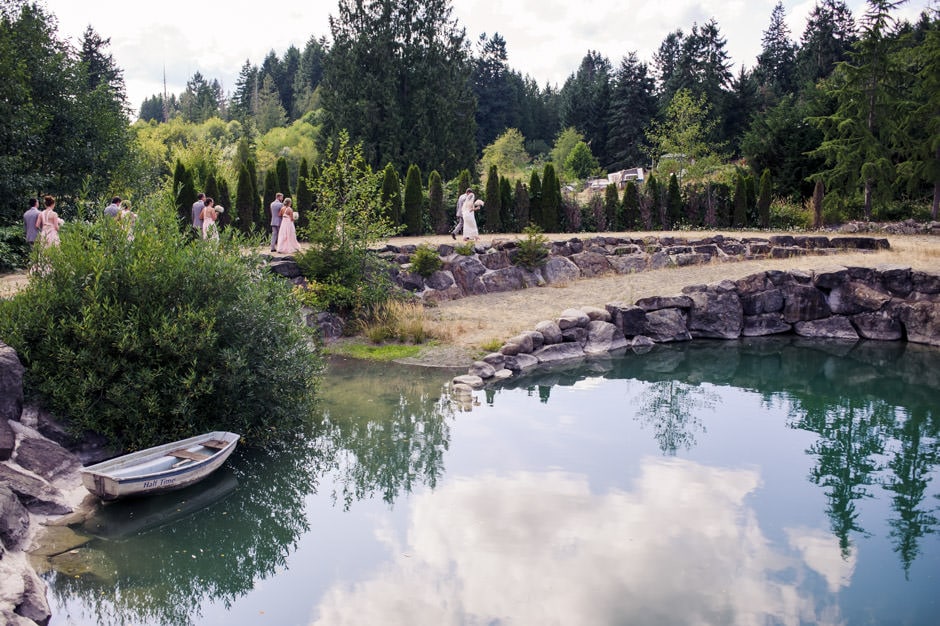 wedding party walking around pond