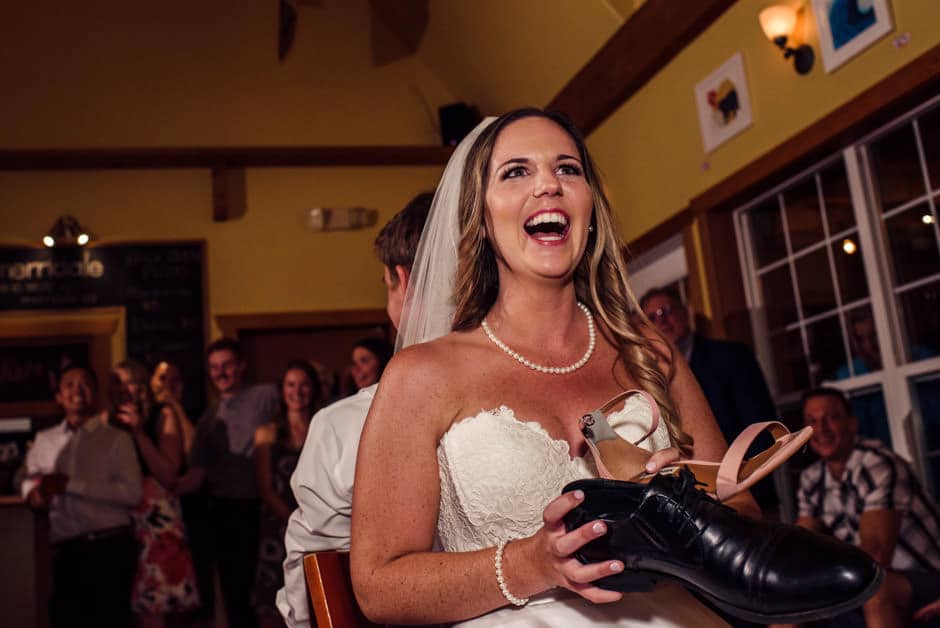 bride laughing during shoe game