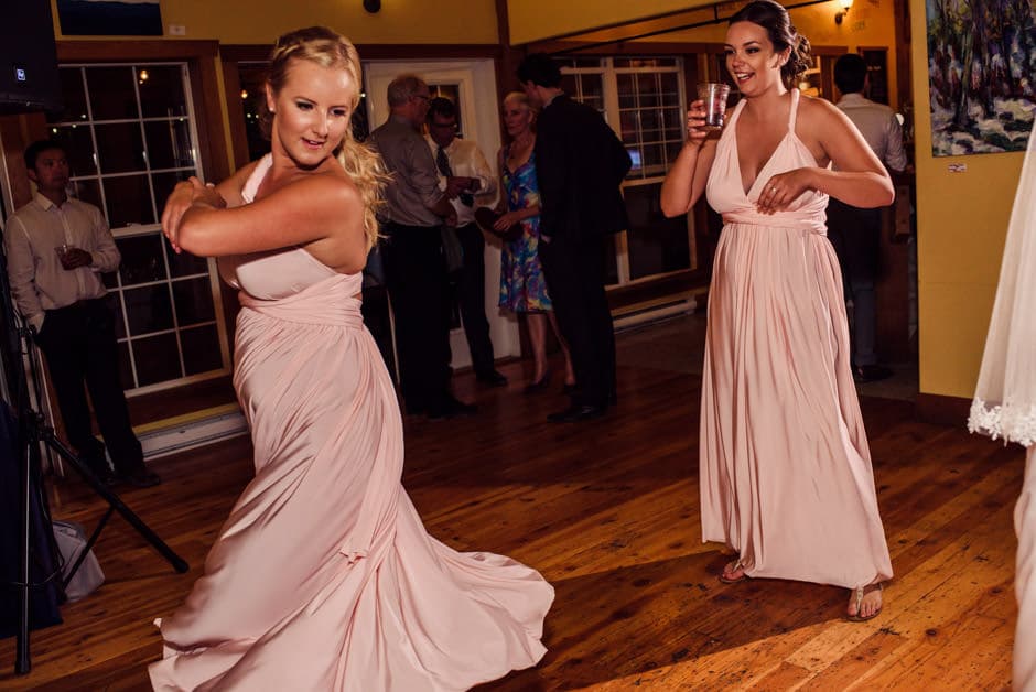 bridesmaids in pink dresses dancing