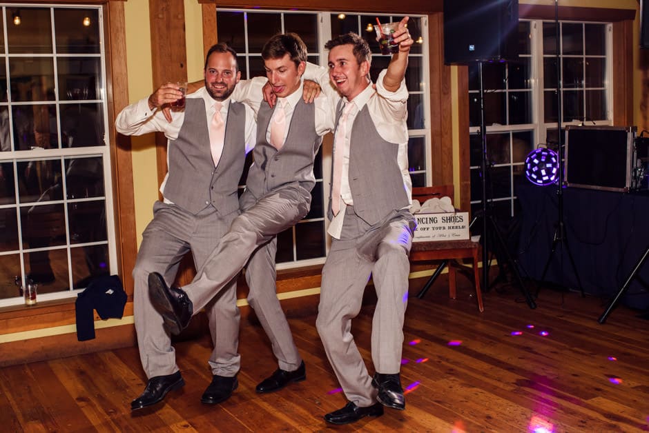 groom and groomsmen doing the can can