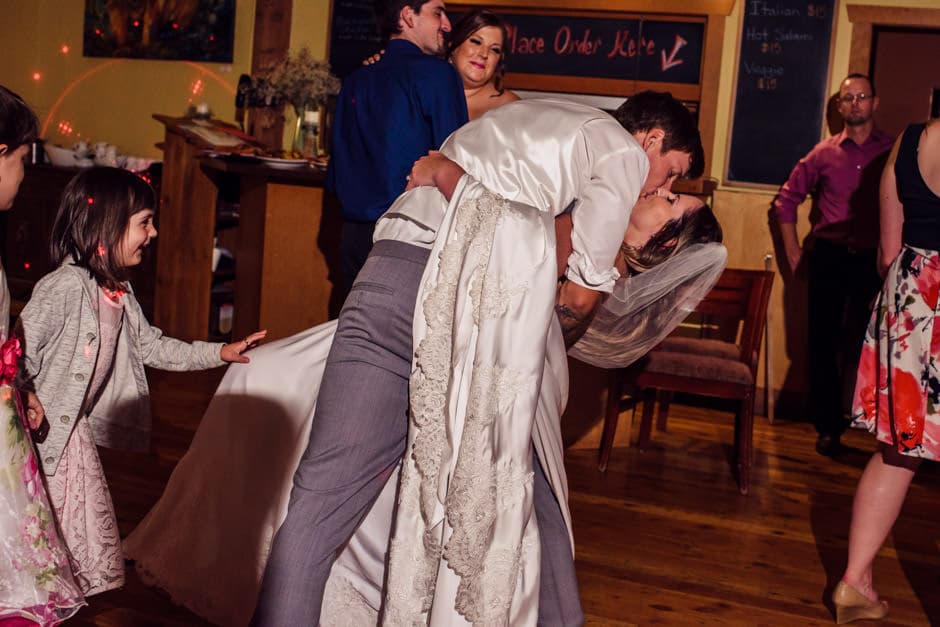 groom dipping bride on dance floor