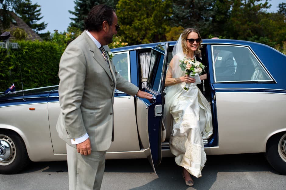 bride arriving at wedding ceremony in classic car