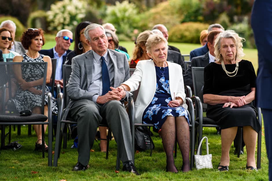 groom's parents watching wedding ceremony