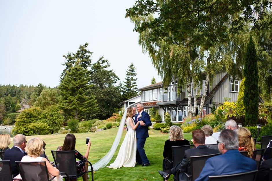 bride and groom dancing during wedding ceremony at deep cove chalet