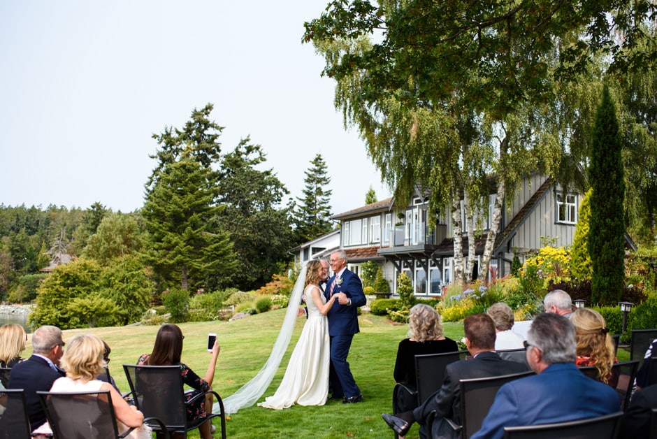 bride and groom dancing during wedding ceremony at deep cove chalet