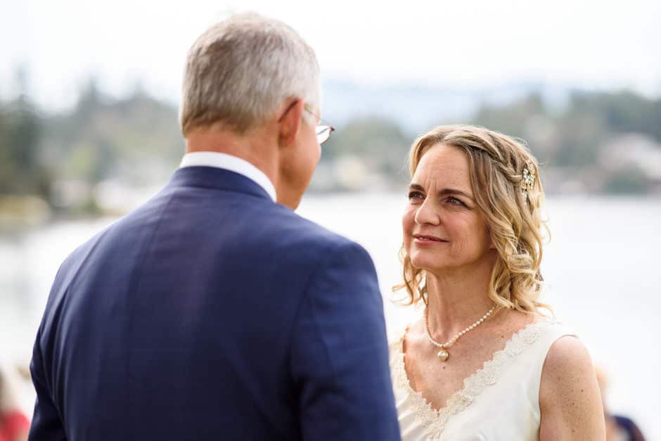 bride smiling gently during oceanfront wedding ceremony