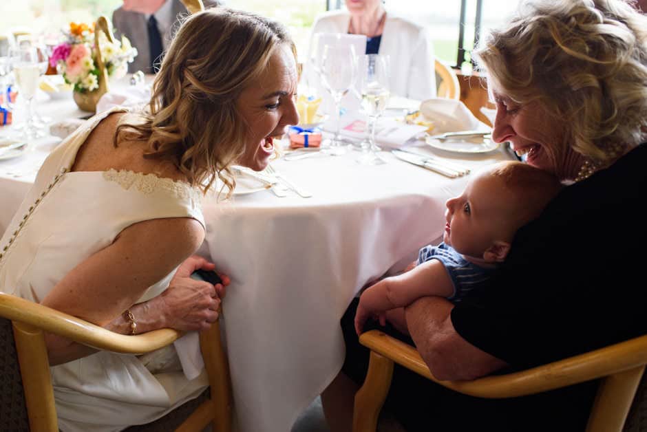 victoria bc documentary wedding photography - bride and mother playing with baby