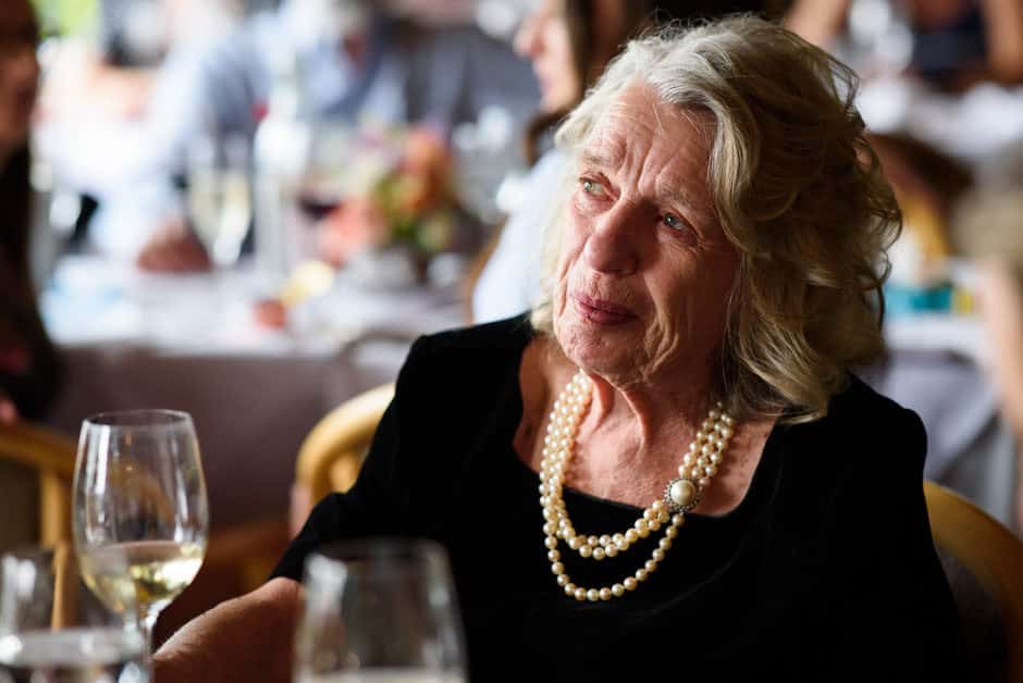 mother of the bride listening to wedding toast