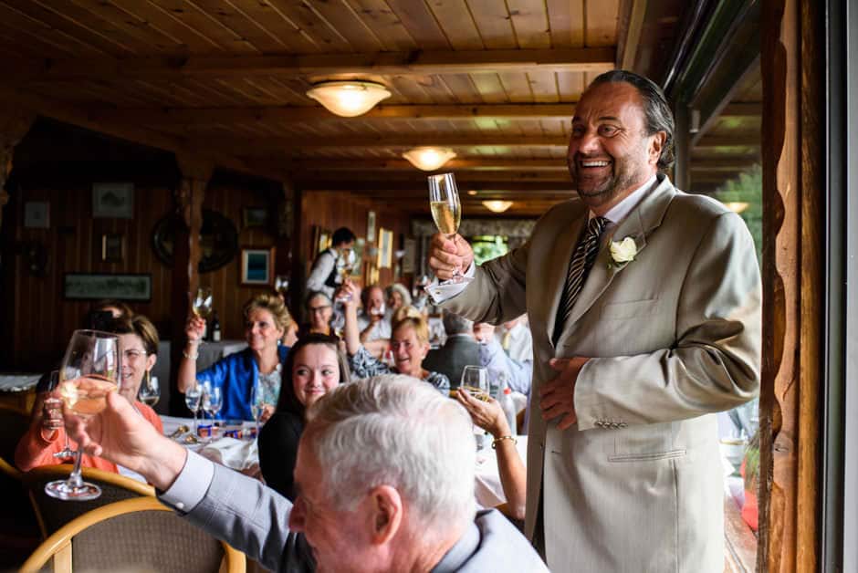 mc and crowd toasting wedding couple