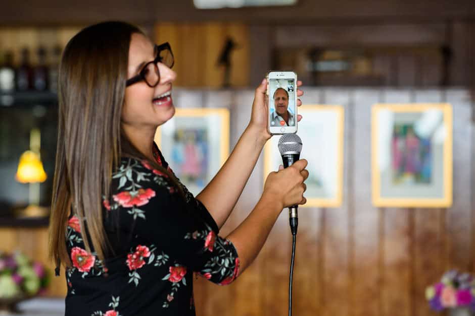 groom's brother giving toast via facetime on phone