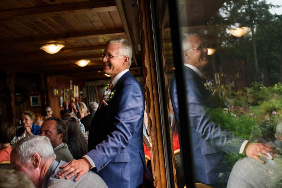 groom and reflection listening to speeches