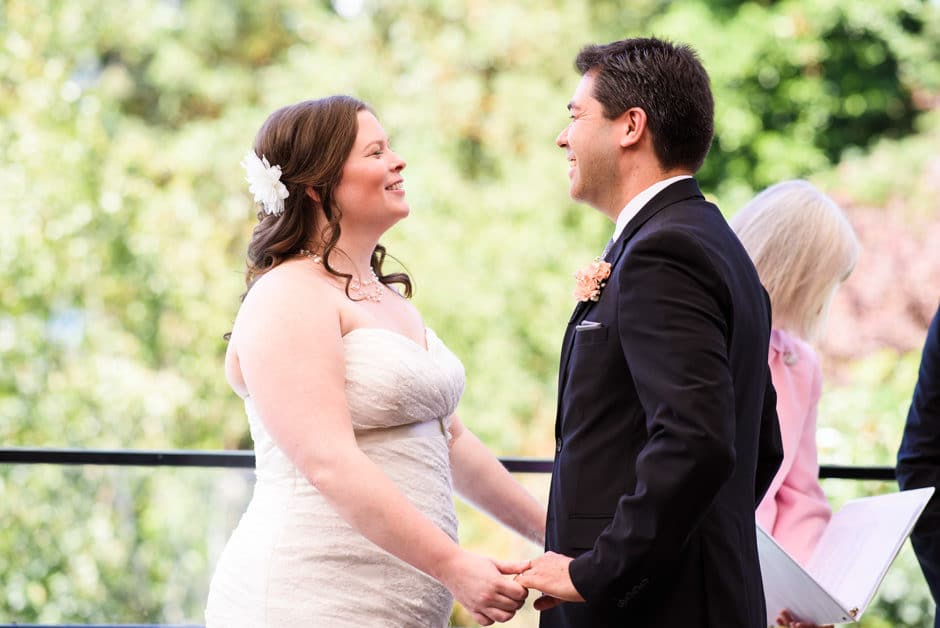 couple laughing before first kiss during ceremony