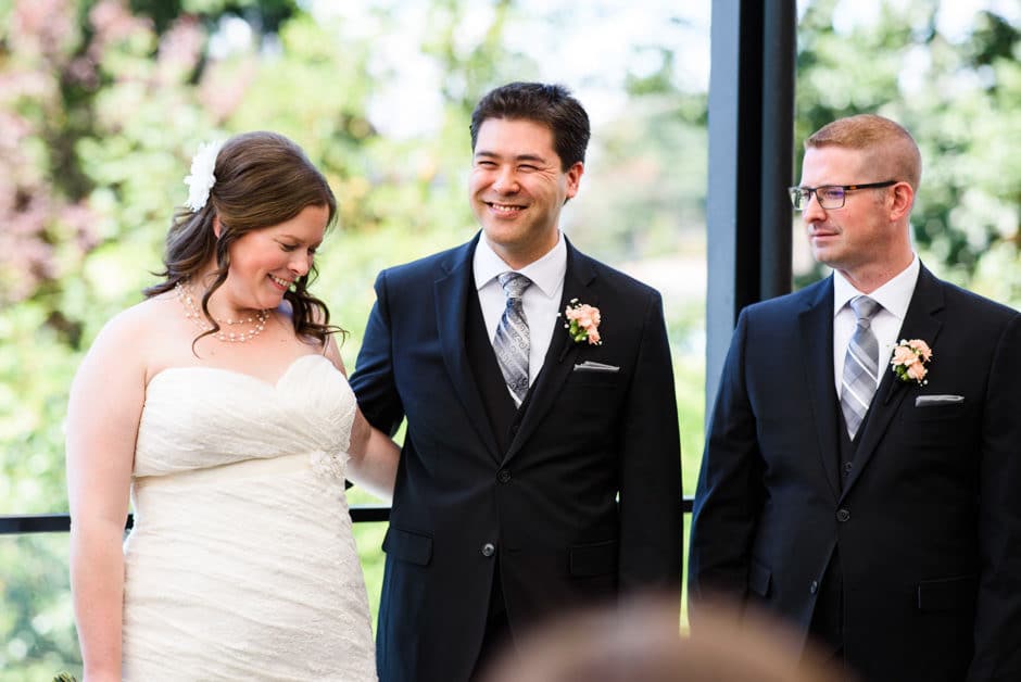 bride and groom laughing during ceremony