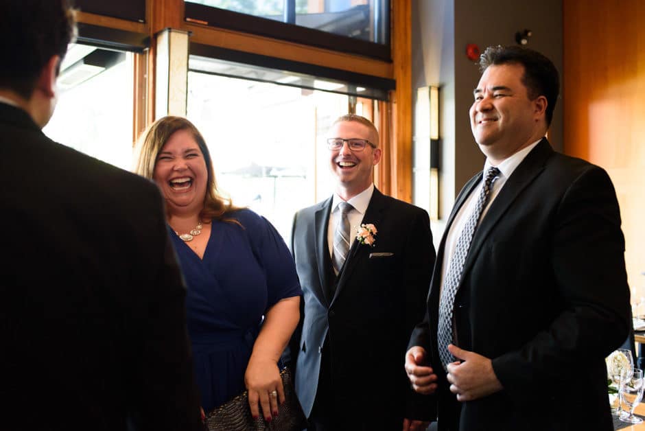 guests laughing at wedding reception