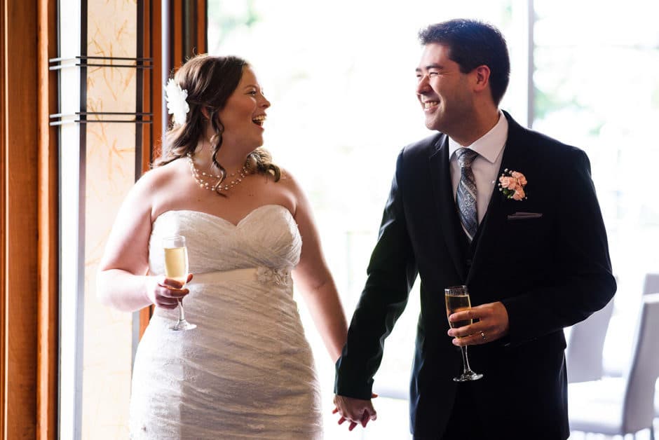 couple laughing during wedding toast